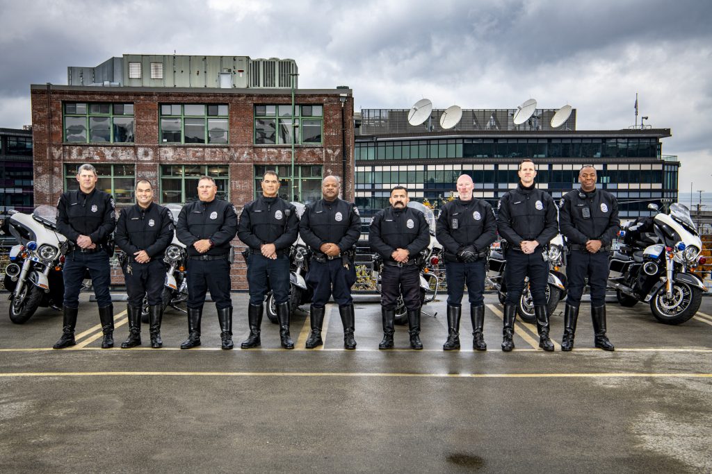Seattle Police Department Motorcycle officers standing on the top level of the T-Mobile field parking garage