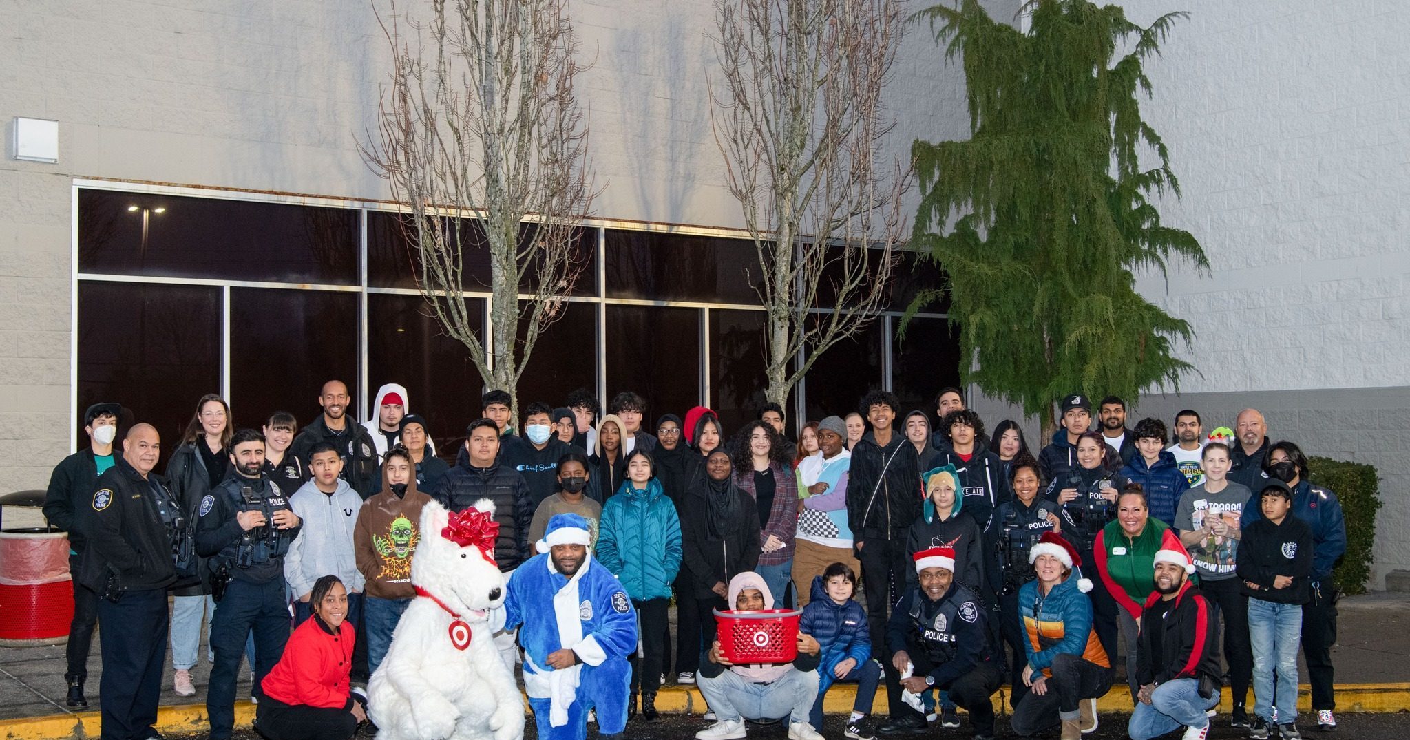 Large group of people gathered outside a Target store for a holiday shopping spree